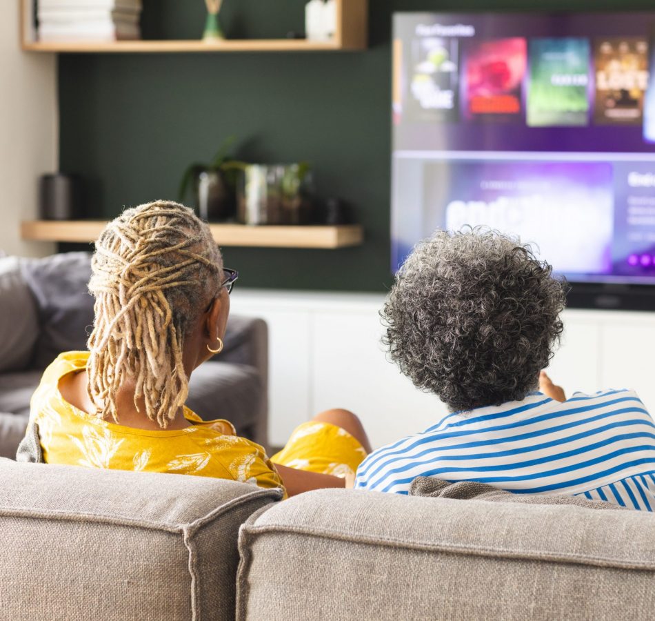 Two_People_Watching_TV_While_Sitting_On_The_Couch_original_3219467 Two_People_Watching_TV_While_Sitting_On_The_Couch_original_3219467